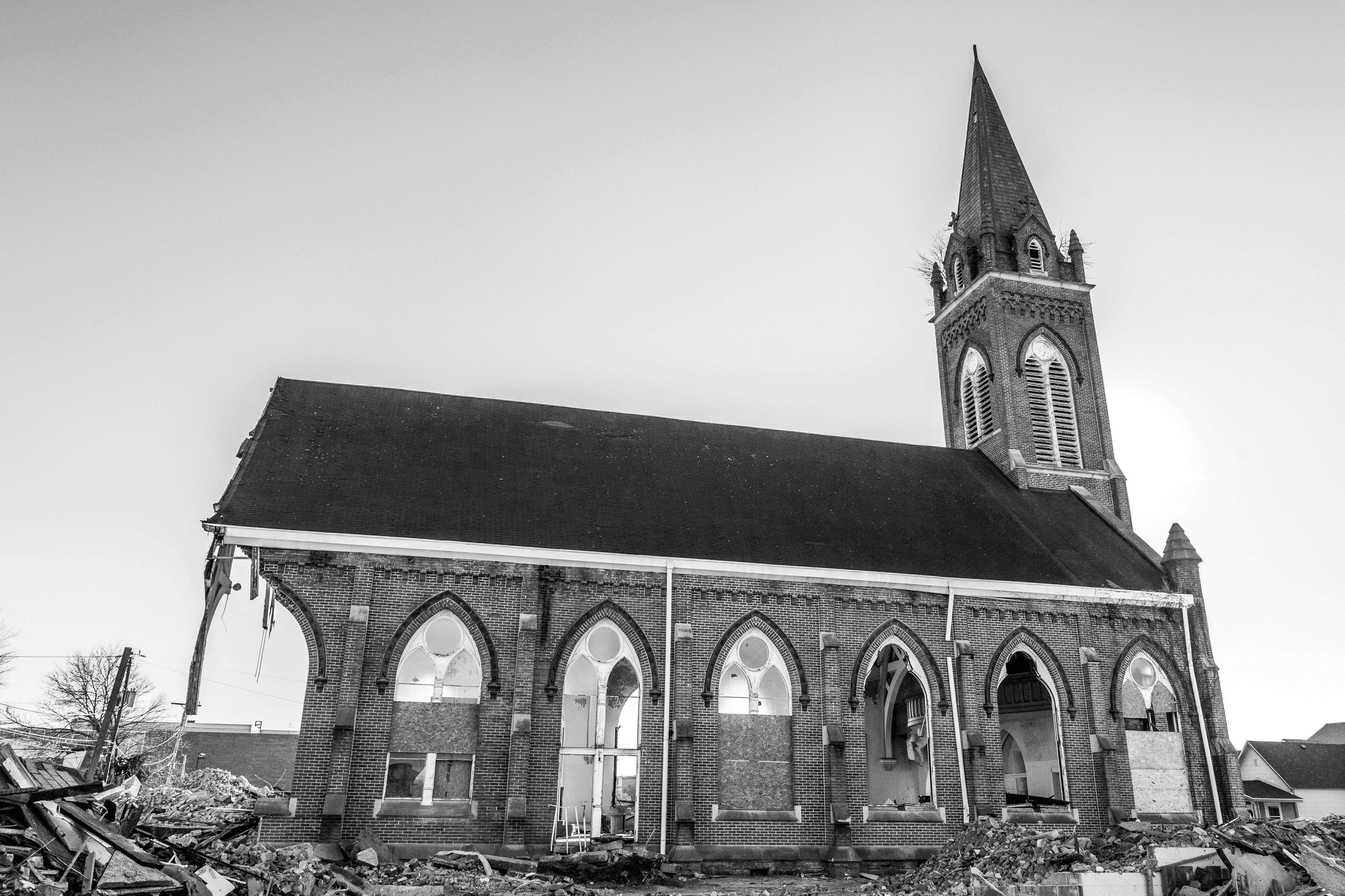 a black and white photo of an old church