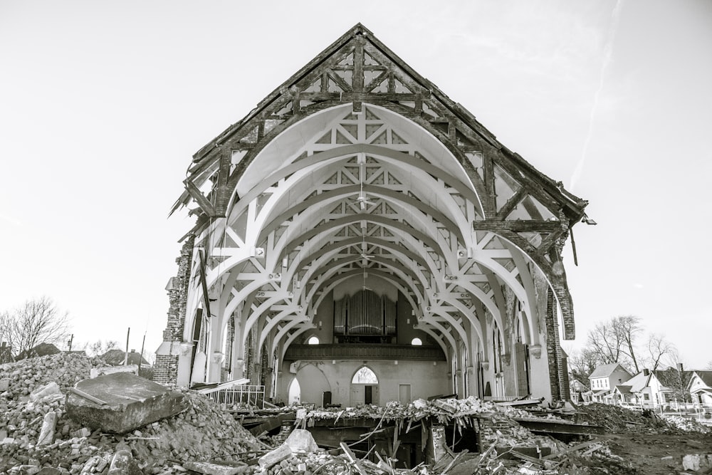 a very large building that has a bunch of rubble in front of it