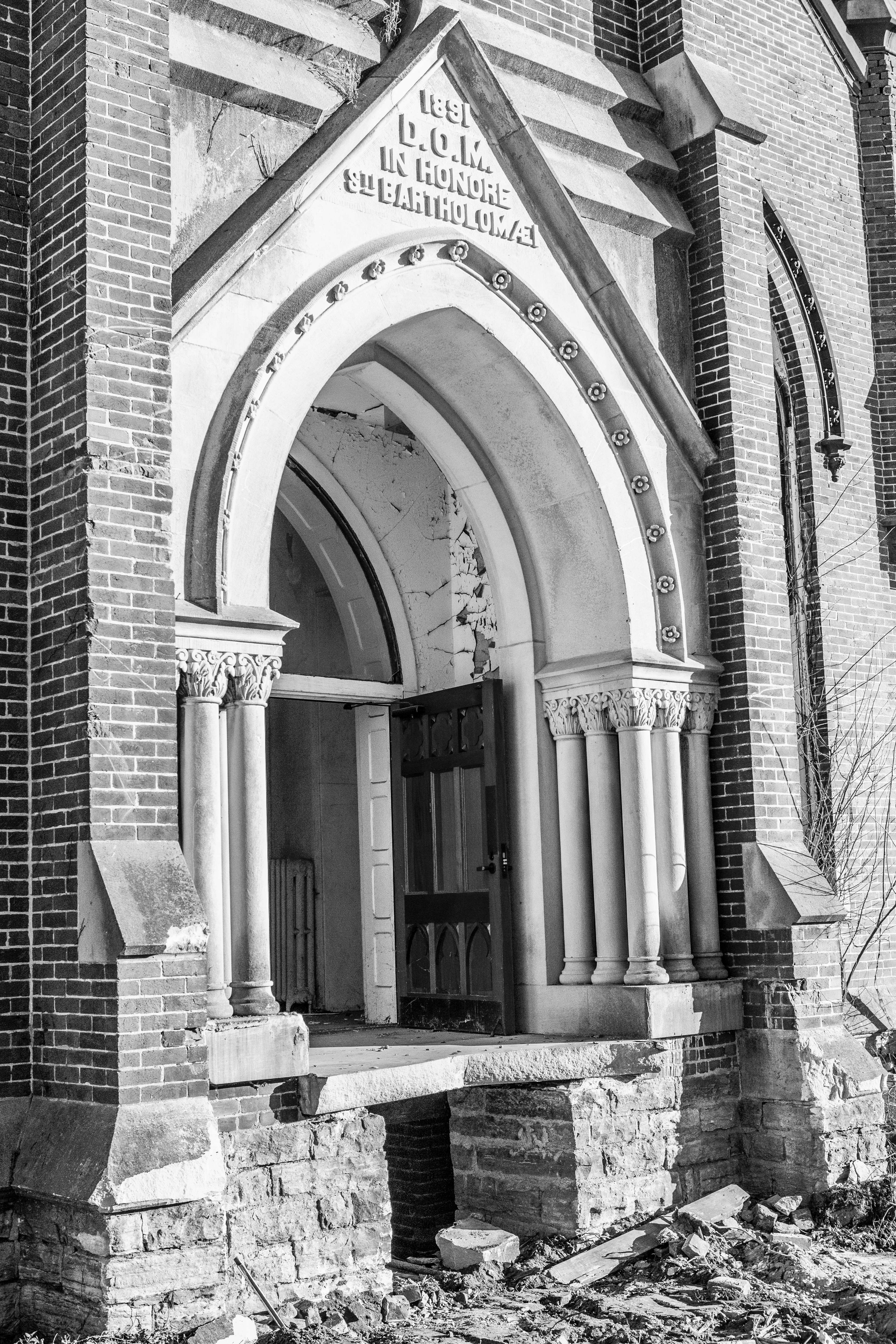 a black and white photo of an old church