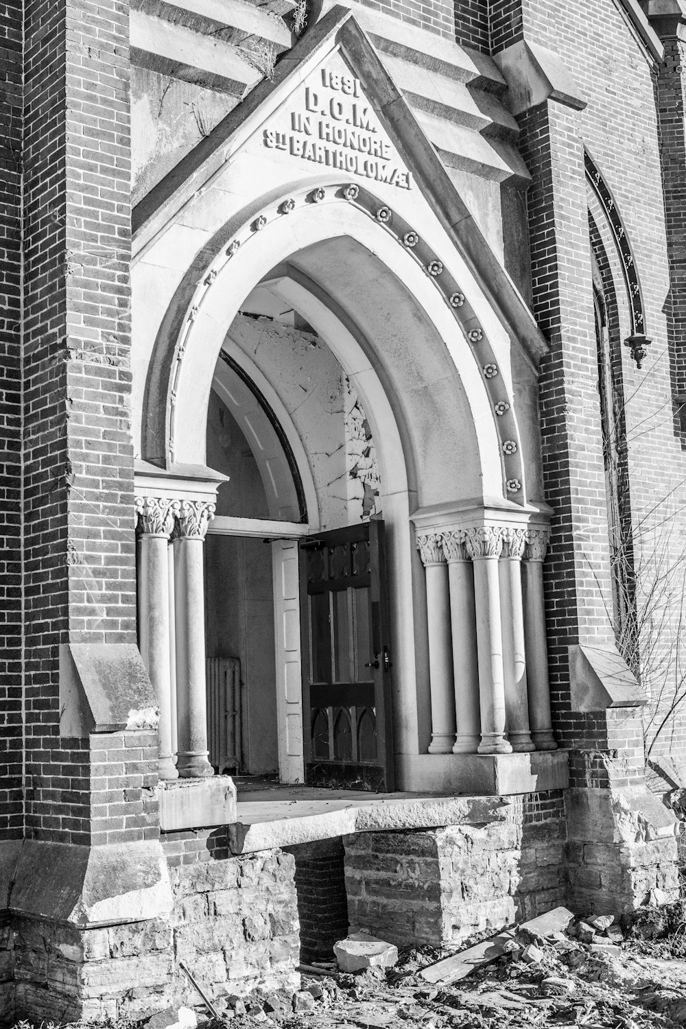 a black and white photo of an old church