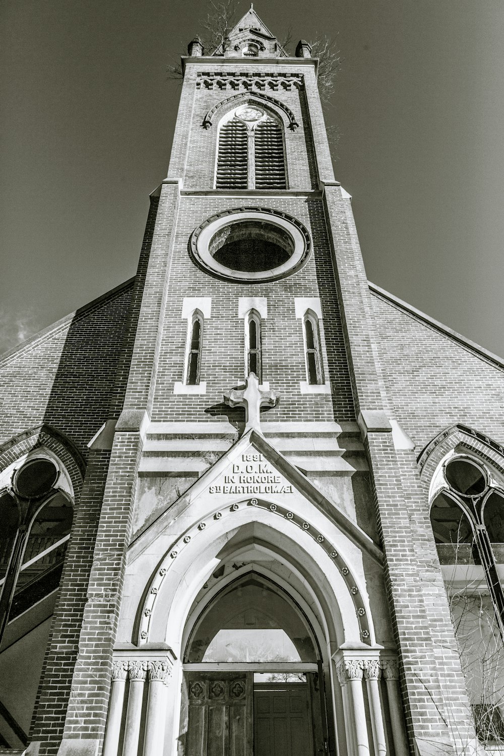 a black and white photo of an old church