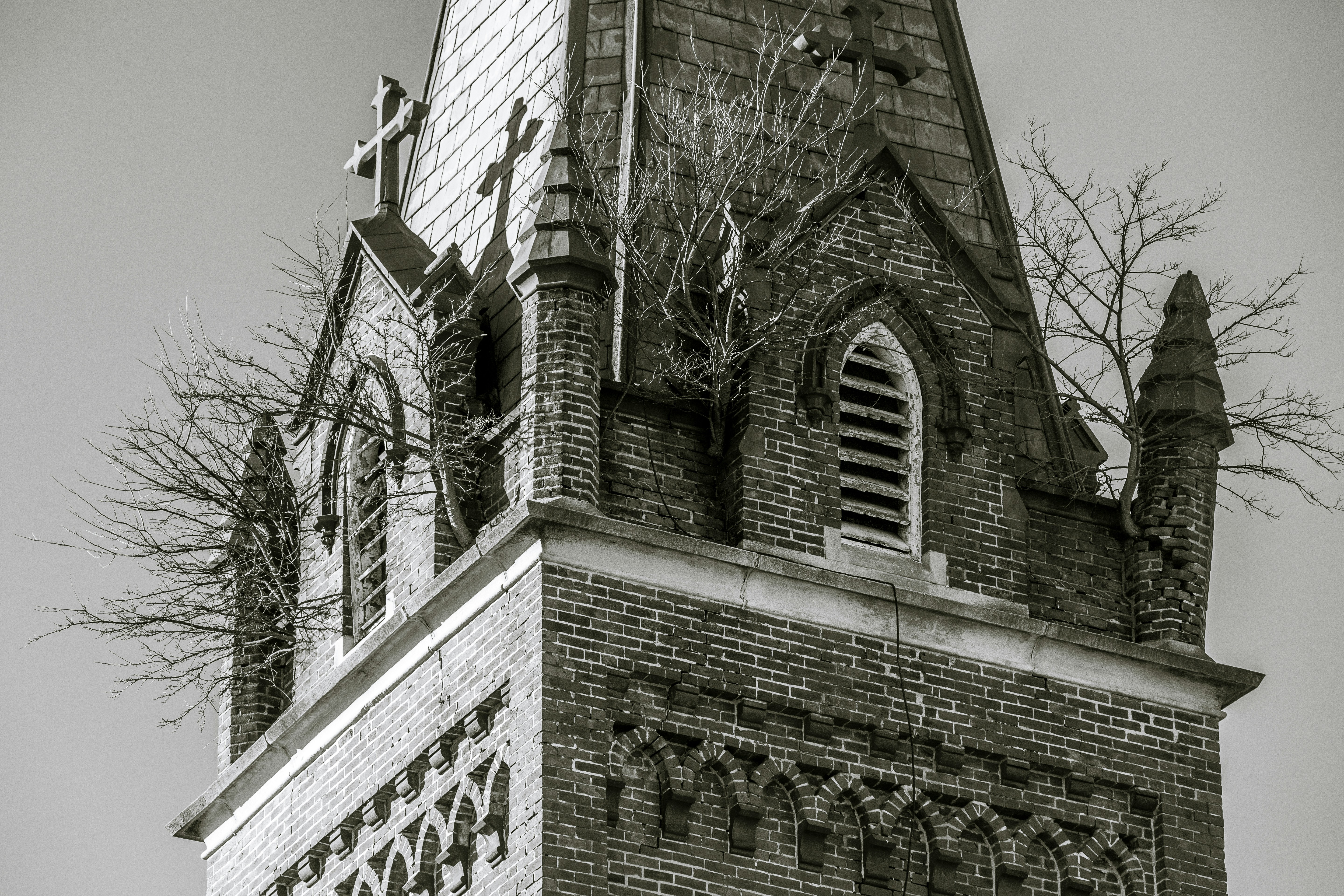 a black and white photo of a church steeple