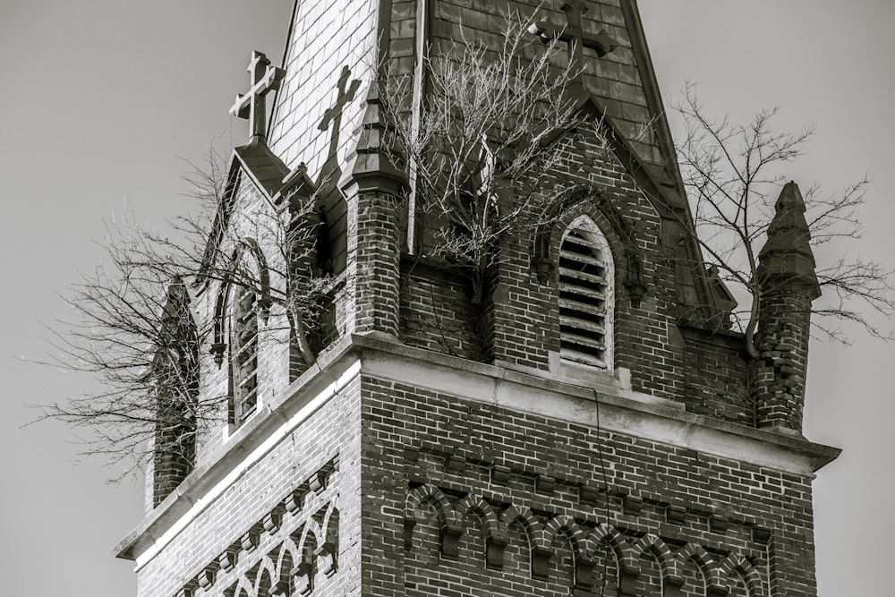 a black and white photo of a church steeple