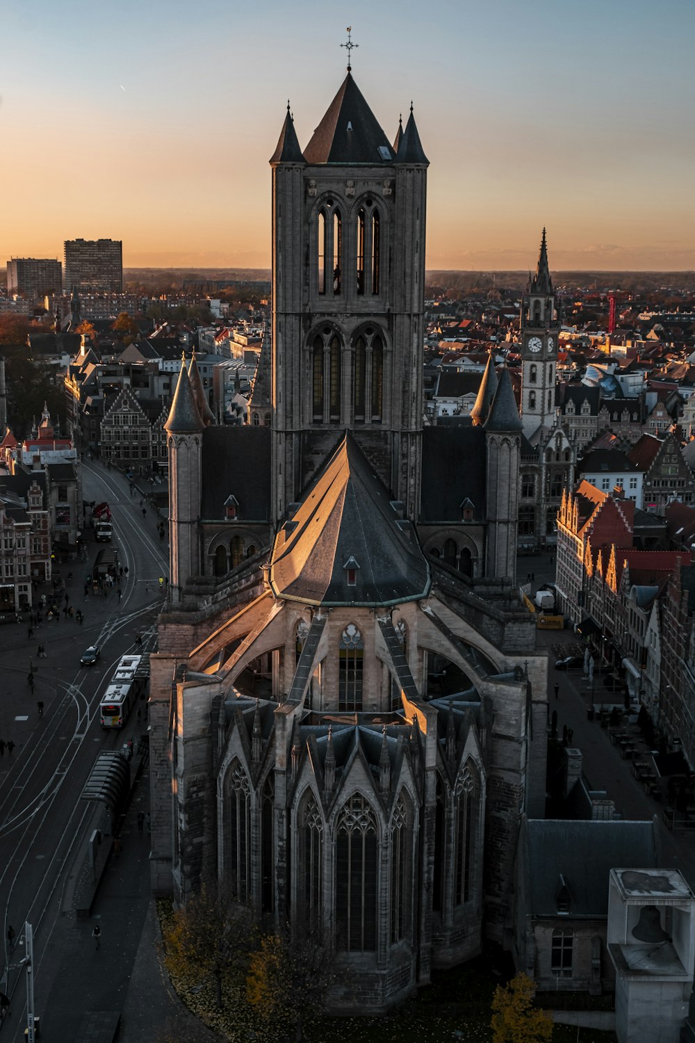 an aerial view of a city at sunset