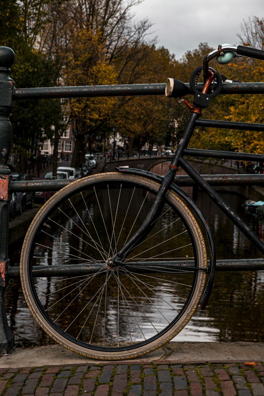 a bicycle parked next to a parking meter