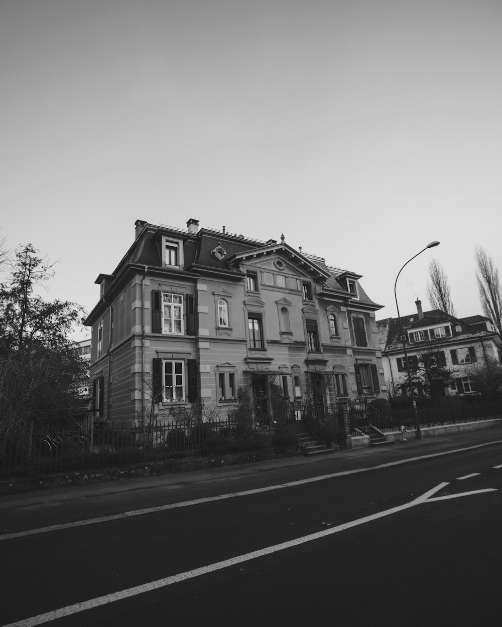 a black and white photo of a large house