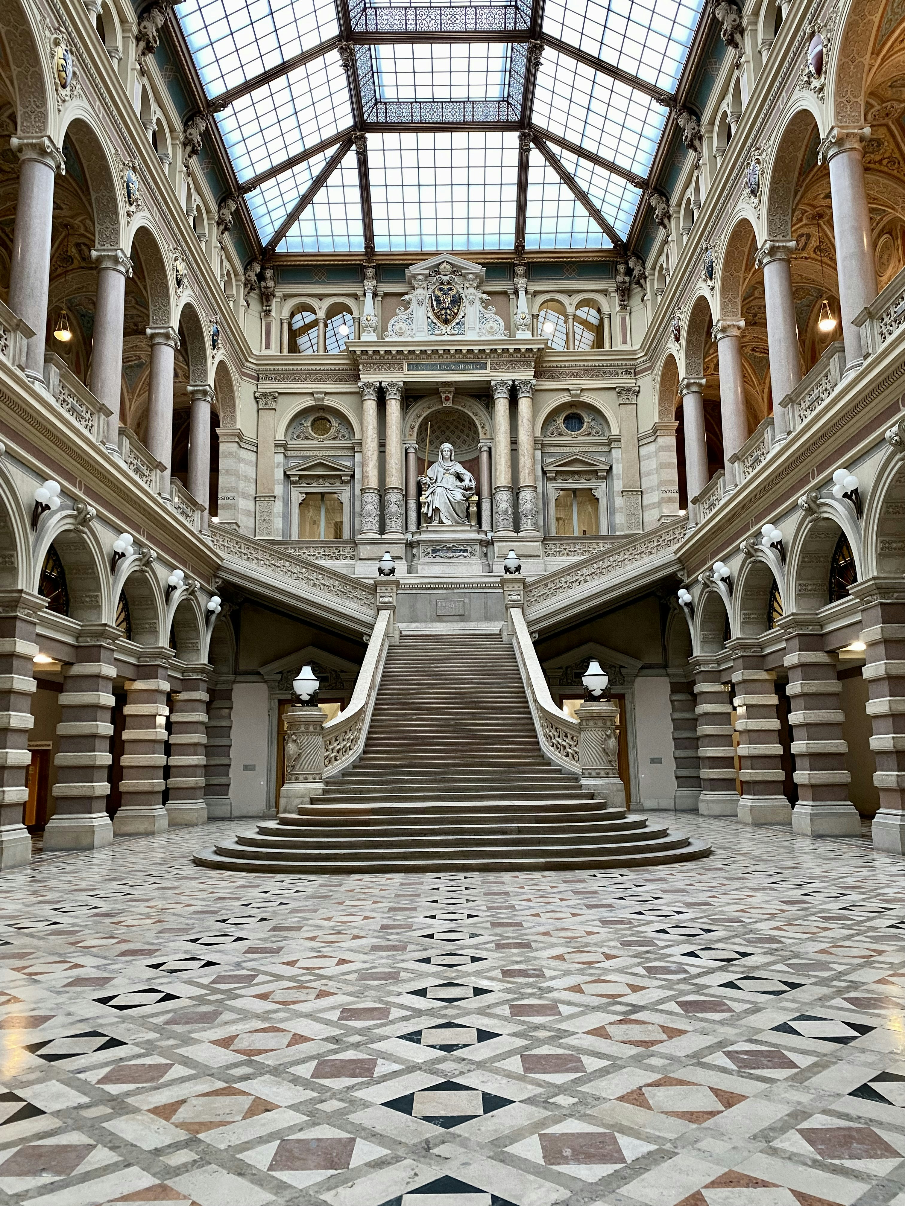 a large building with a staircase and a skylight