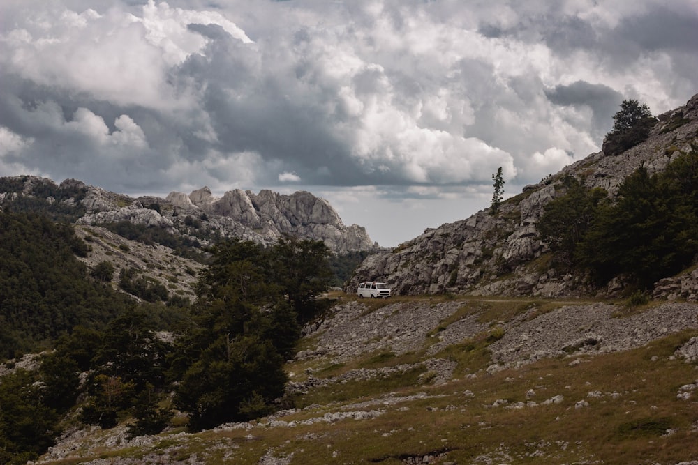 a view of a mountain range with clouds in the sky