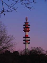 a tall tower with a red and white top