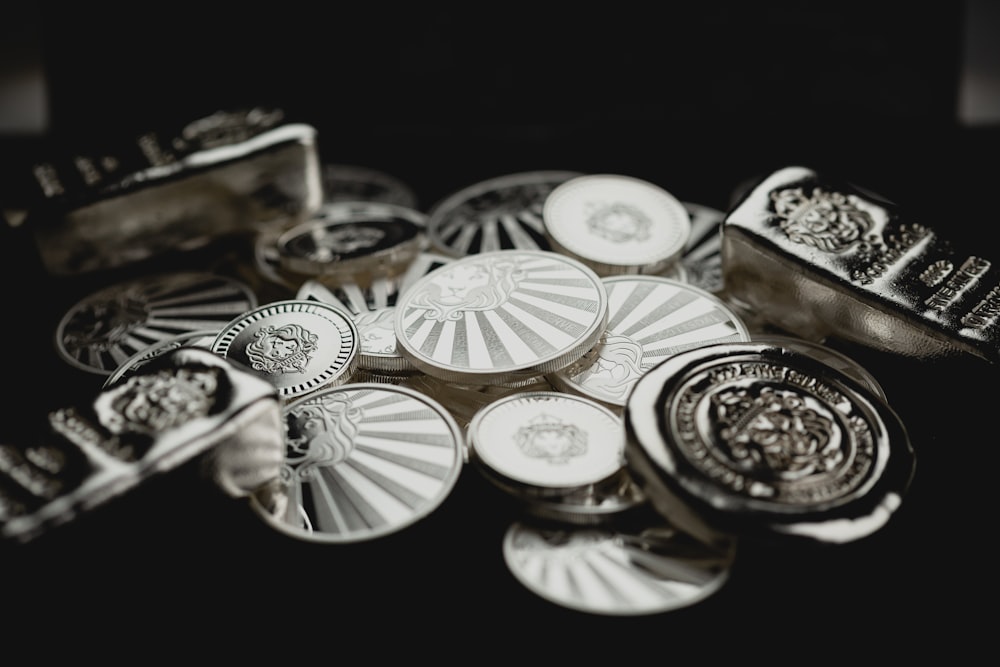 a pile of metal buttons sitting on top of a table