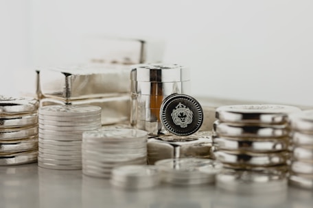 a stack of silver containers sitting on top of a table