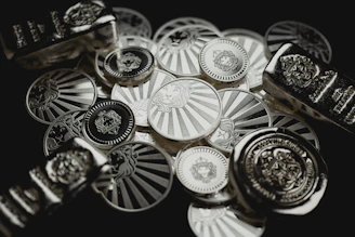 a bunch of metal buttons sitting on top of a table