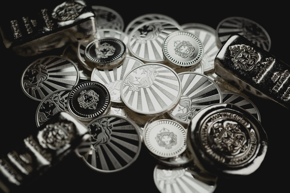 a bunch of metal buttons sitting on top of a table