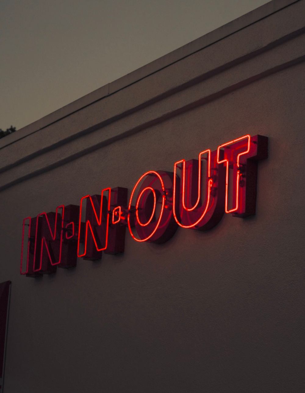 a neon sign on the side of a building