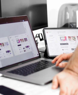 a person sitting at a desk with a laptop