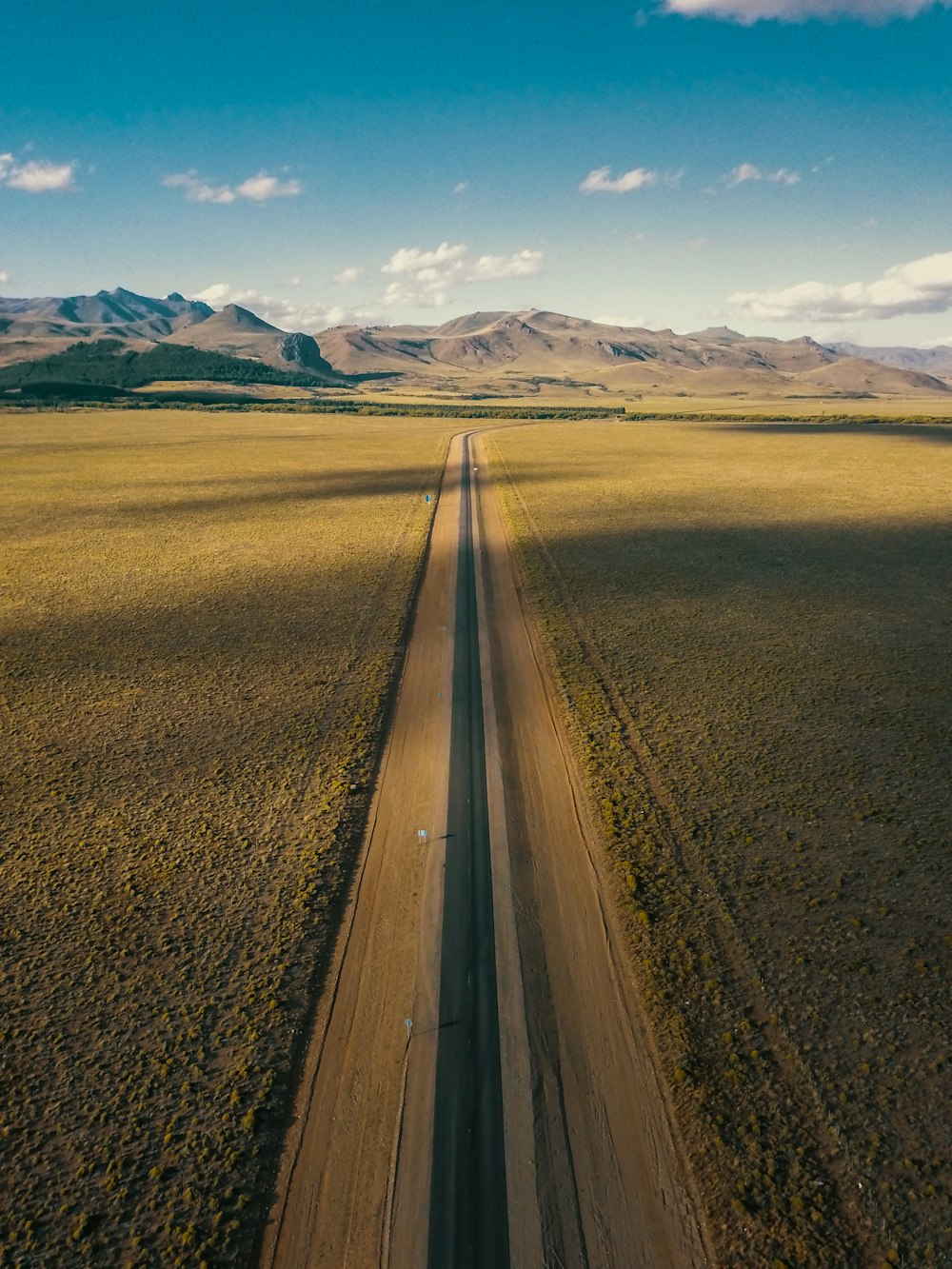 an aerial view of a dirt road in the middle of nowhere