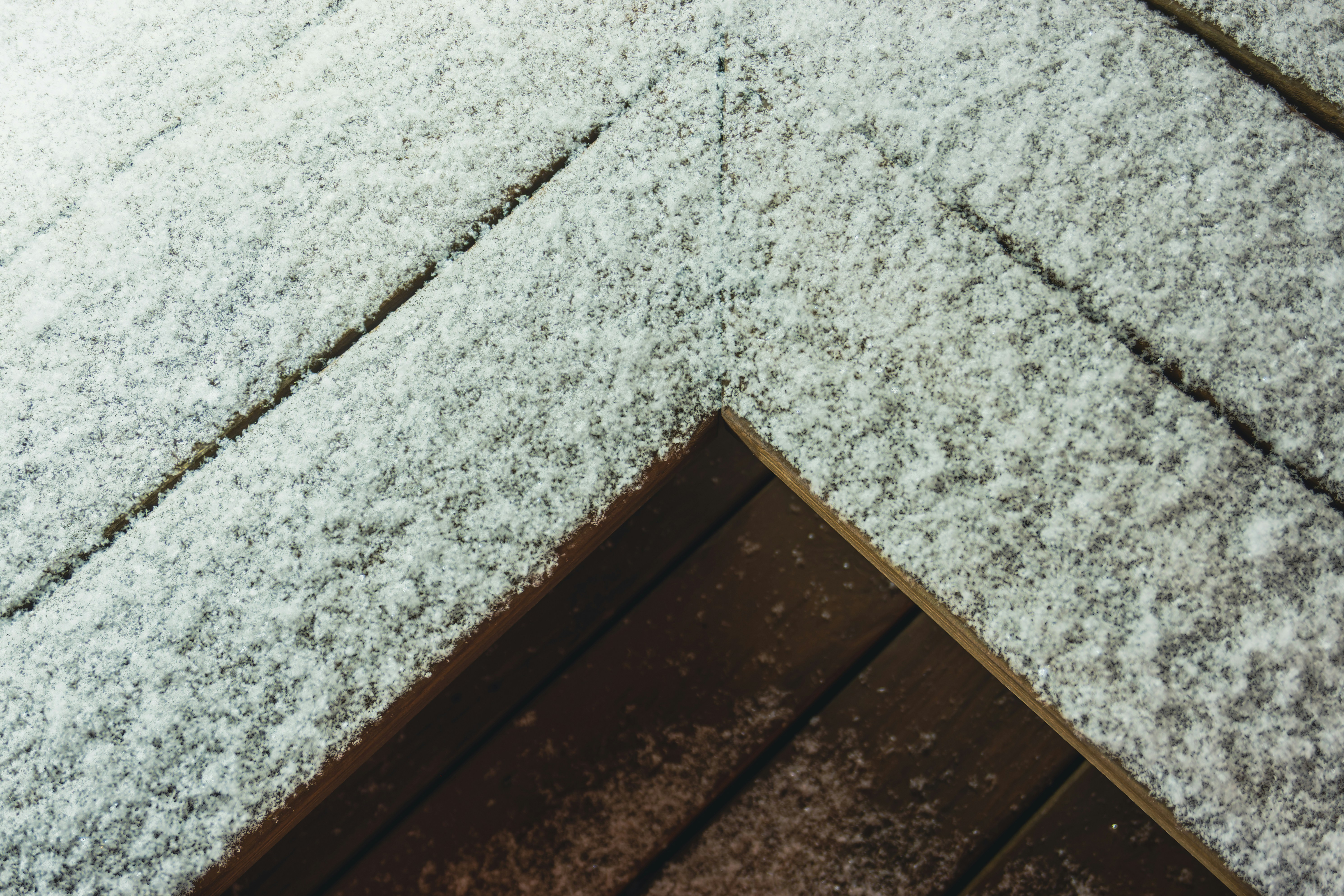 a close up of a snow covered roof