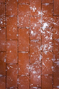 a close up of a red brick wall