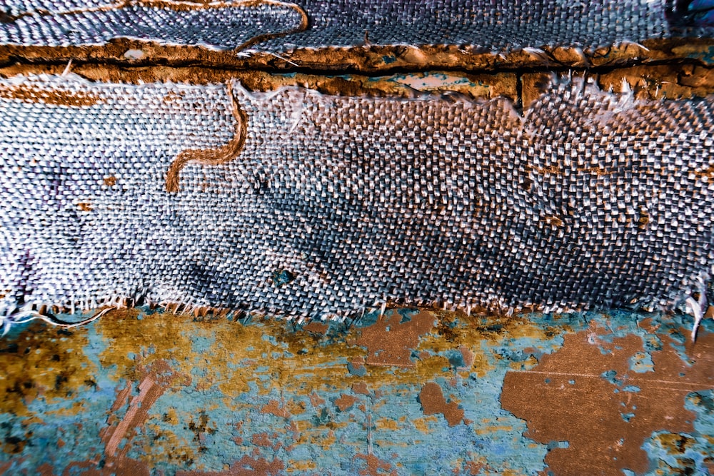 a close up of a piece of cloth with rust on it