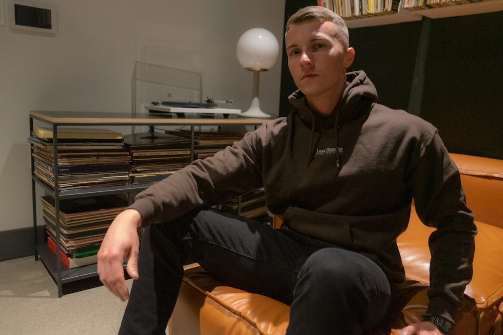 a man sitting on a couch in a room