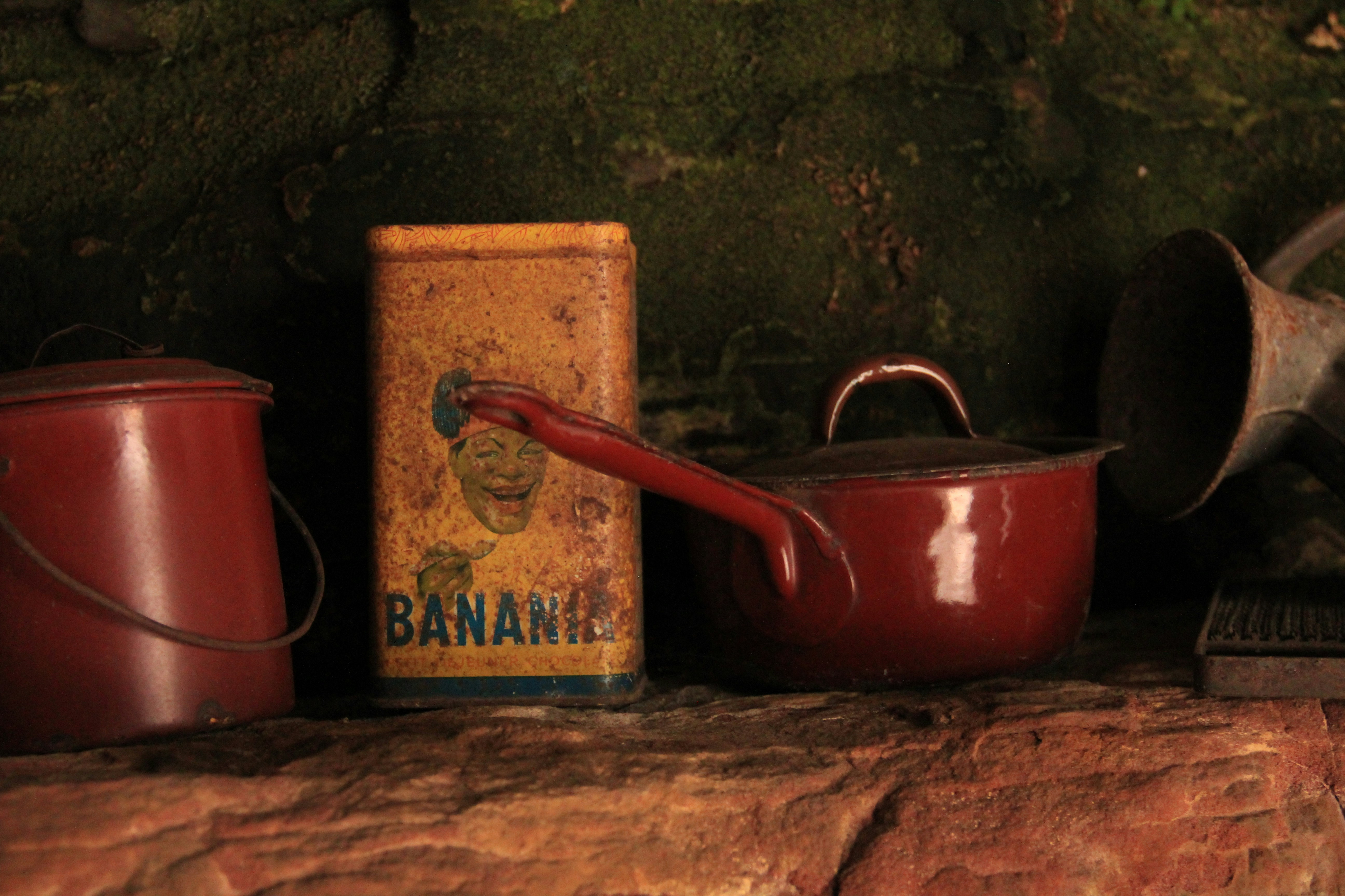 a couple of pots and pans sitting on a shelf