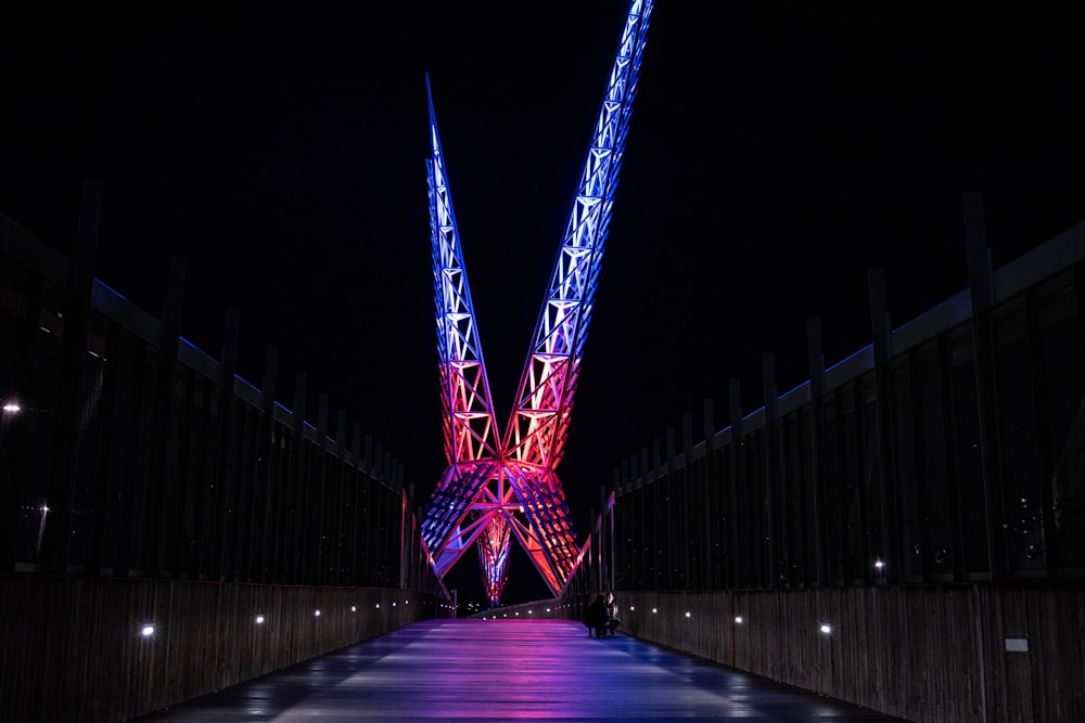 a very tall bridge that has some lights on it