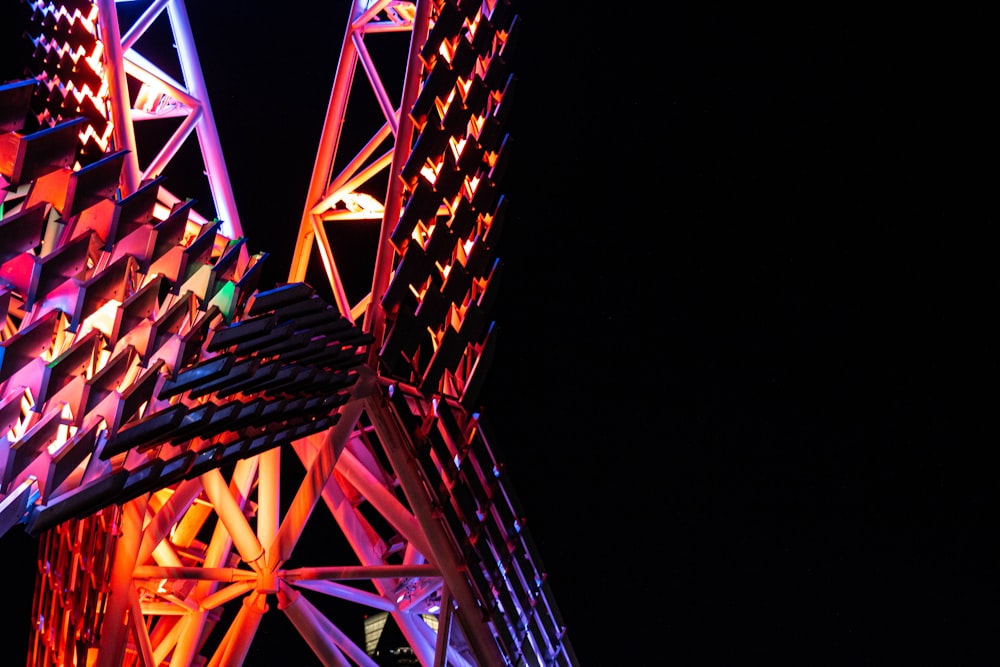 a close up of a very tall structure with lights on it