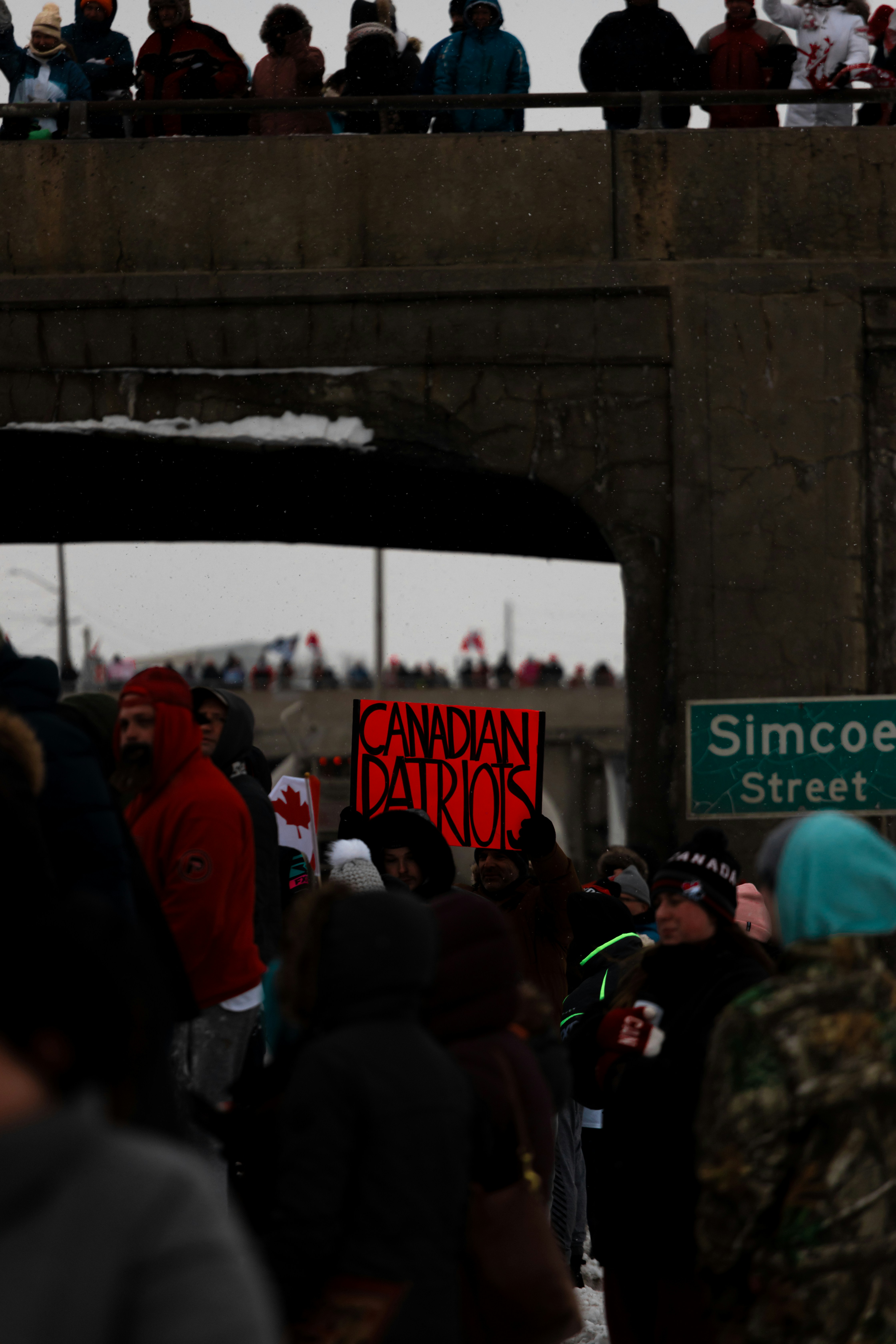 a group of people standing in front of a crowd