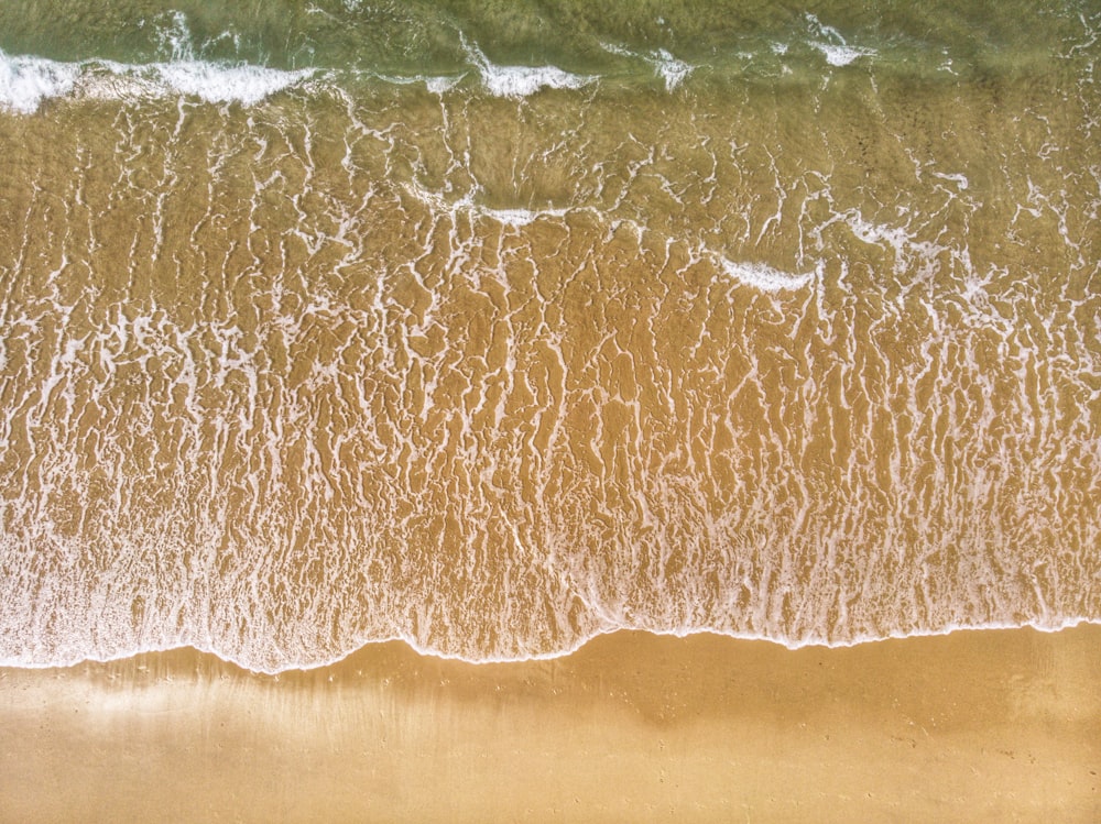 a bird's eye view of a sandy beach