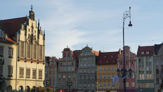 a row of buildings with a clock tower in the middle