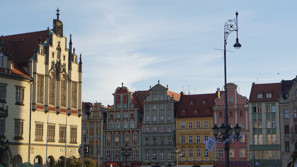 a row of buildings with a clock tower in the middle