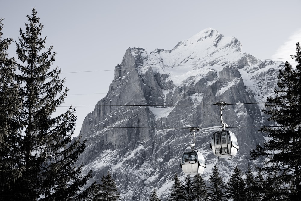 a ski lift with a mountain in the background