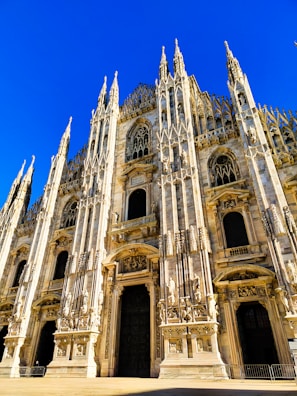 a large cathedral with a clock on the front of it