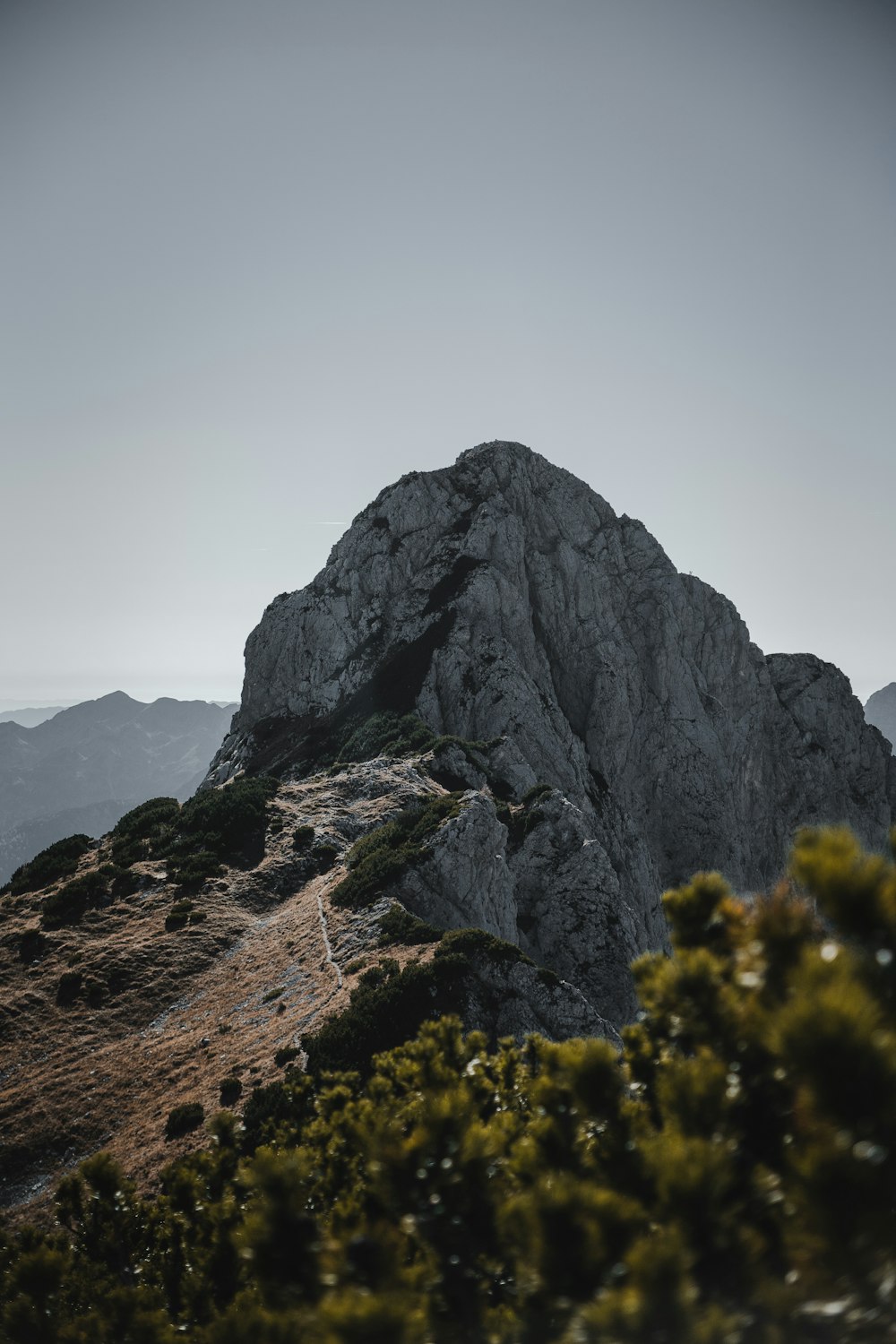 a mountain with a very tall rock on top of it