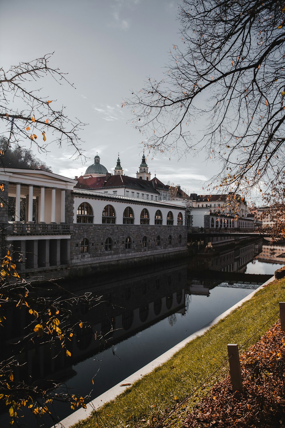 a building sitting next to a body of water