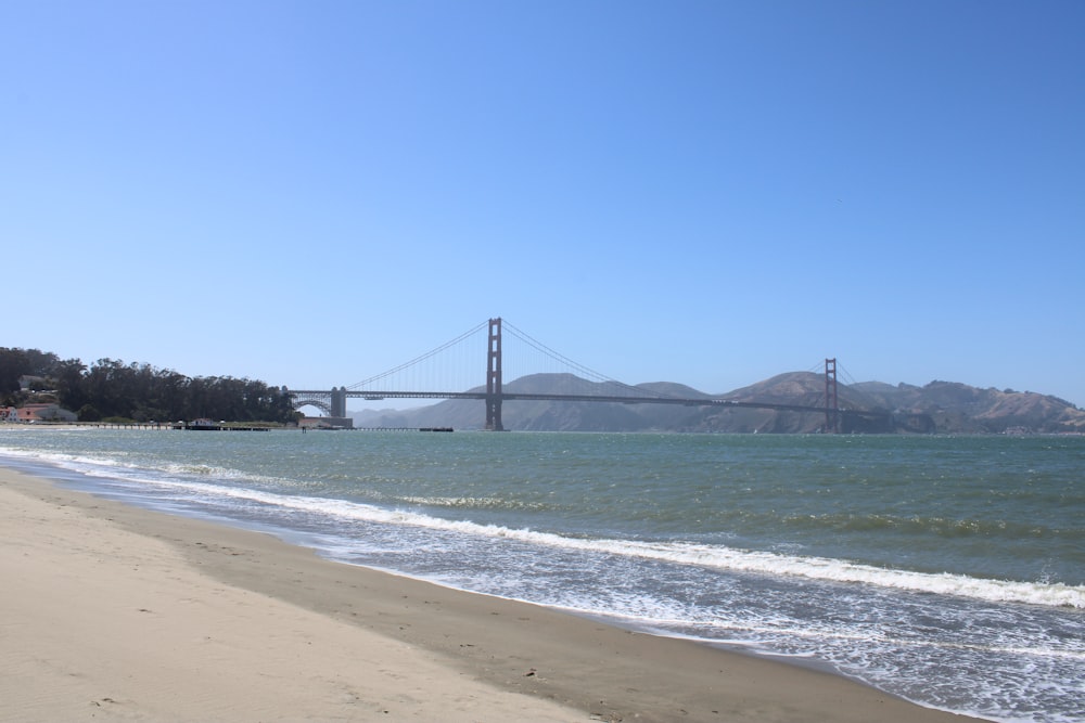 a view of the golden gate bridge from the beach