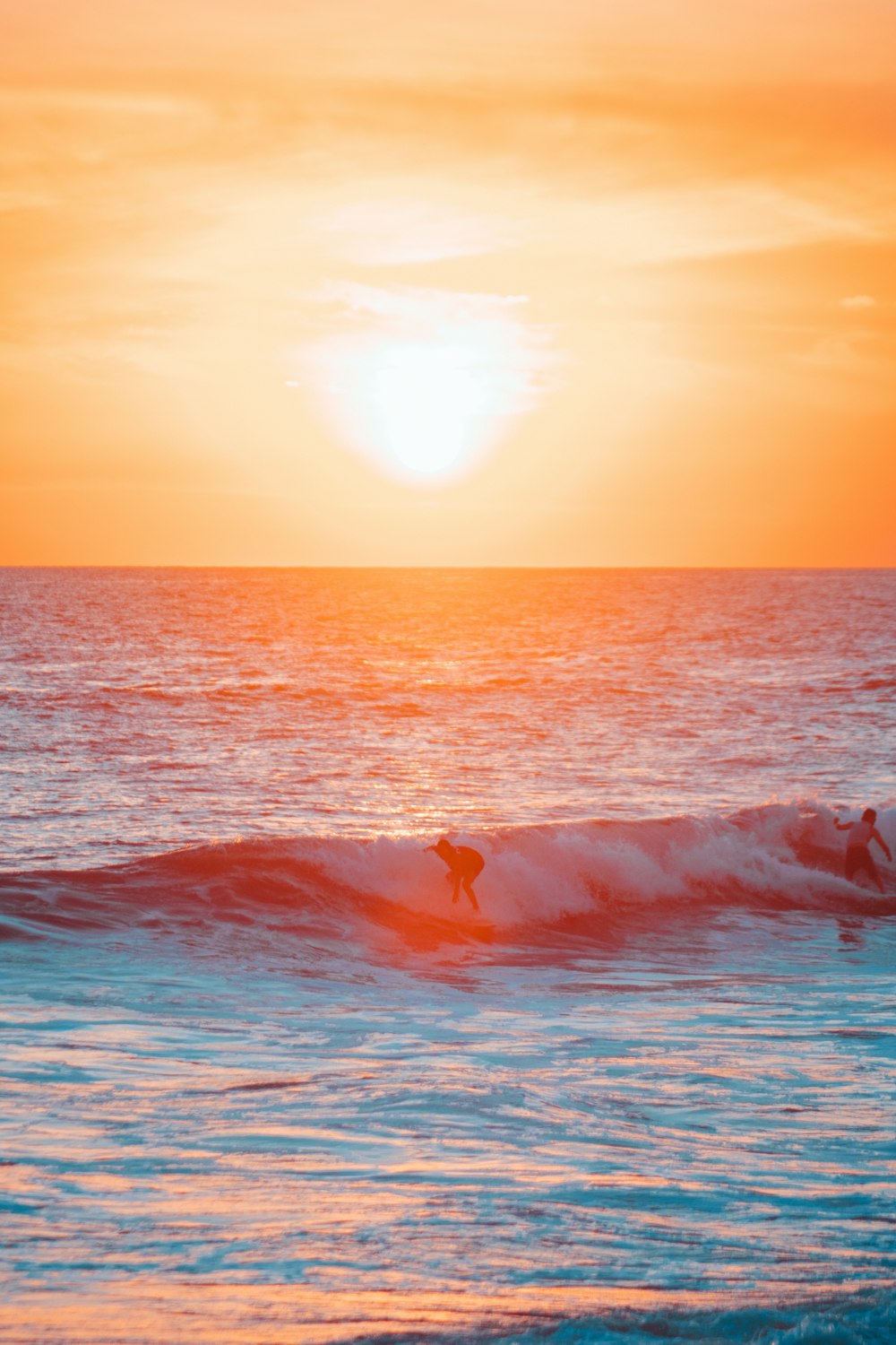 a person riding a surfboard on a wave in the ocean