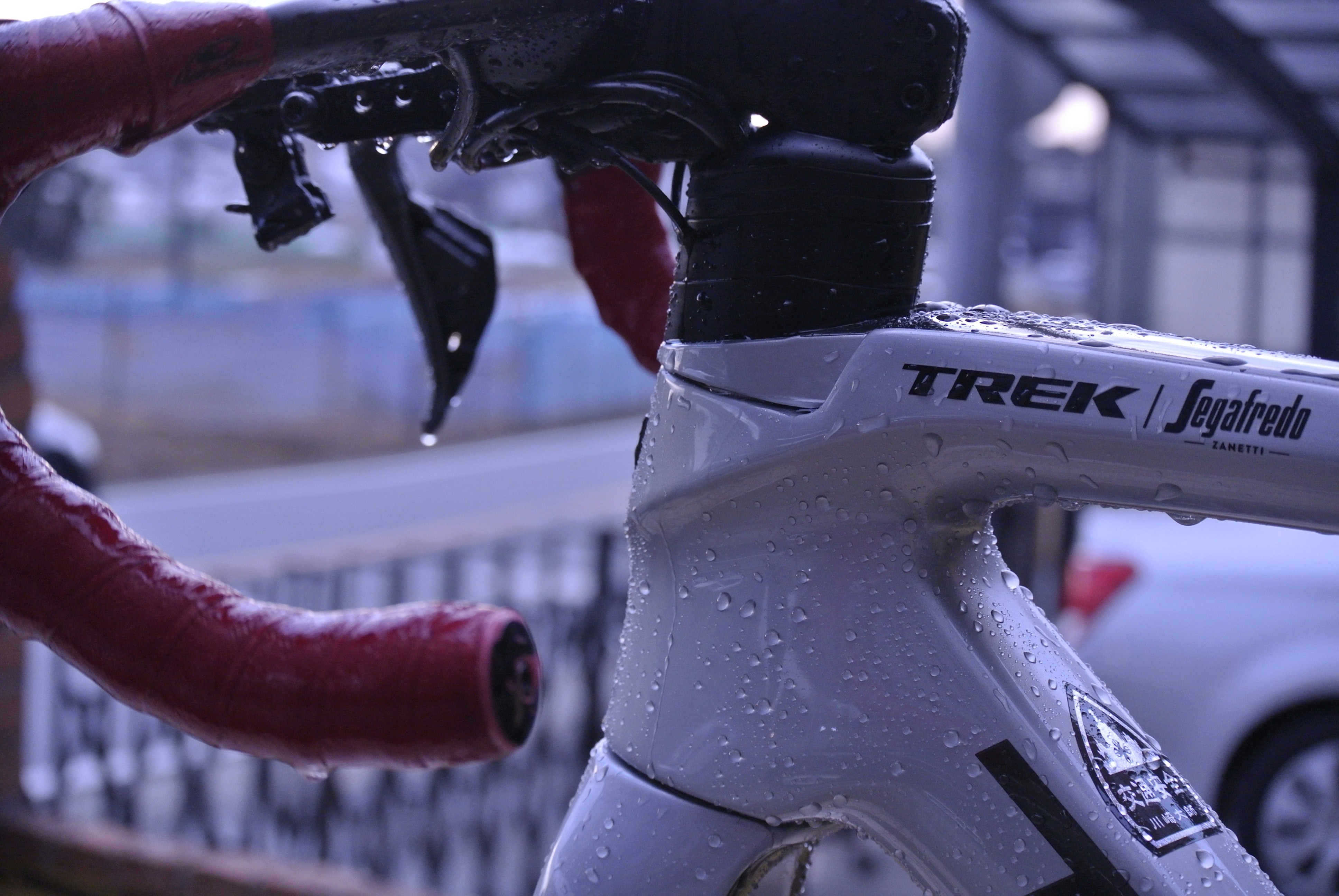 a close up of a bike with water droplets on it