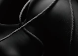 a black and white photo of a rope wrapped around an object