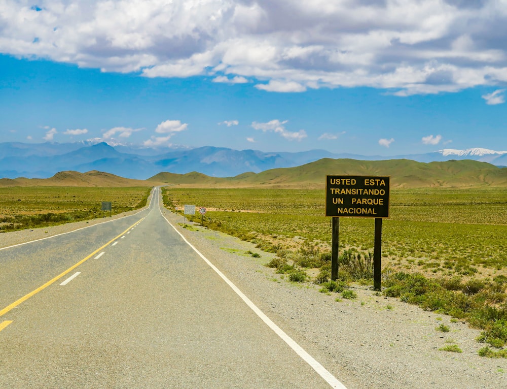 a sign on the side of a road in the middle of nowhere