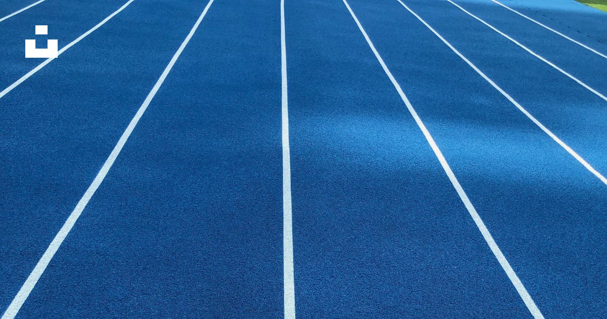 Blue. Track Racetrack A blue running track with white lines on it photo – Free Racetrack ...