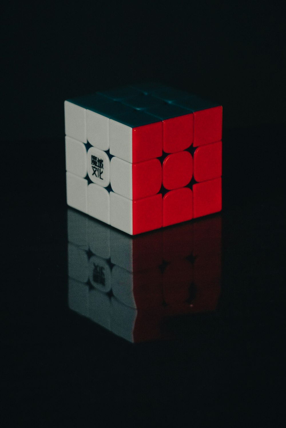 a red and white cube sitting on top of a table