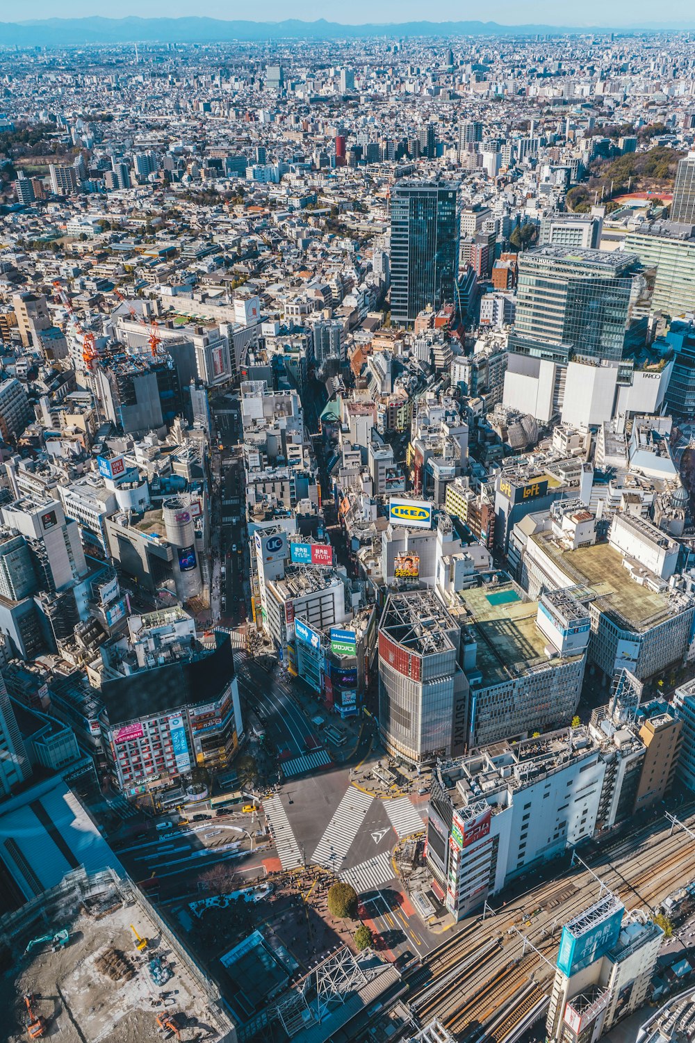 an aerial view of a city with lots of tall buildings