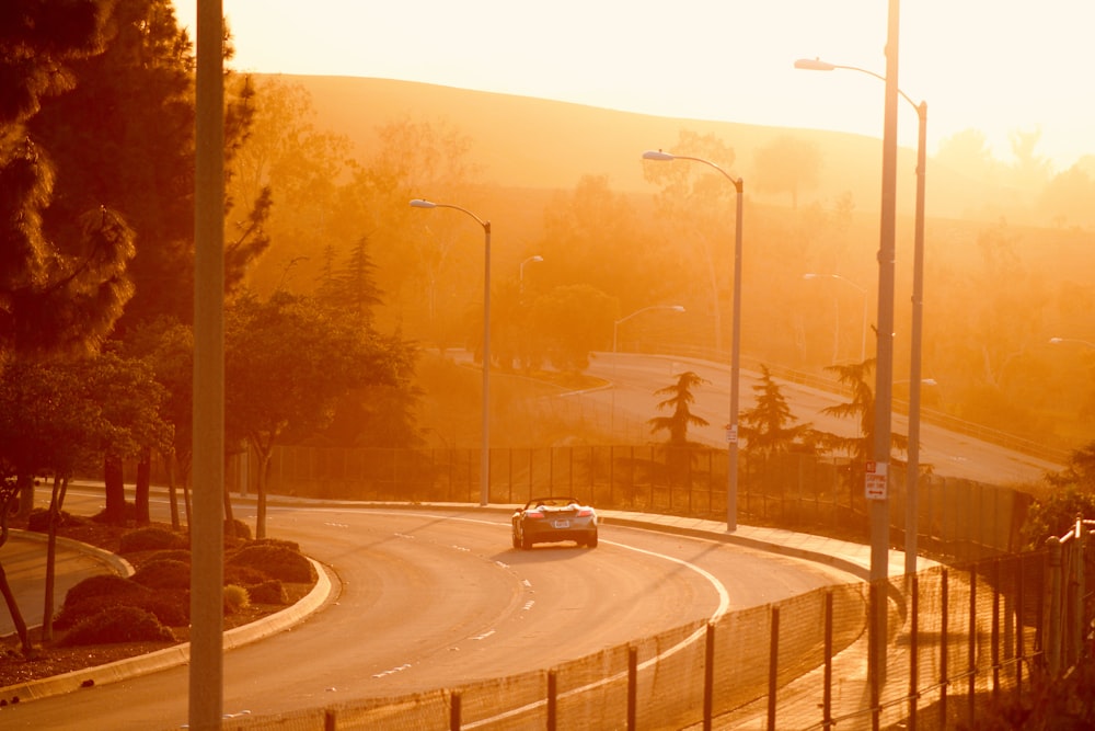 a car is driving down a winding road