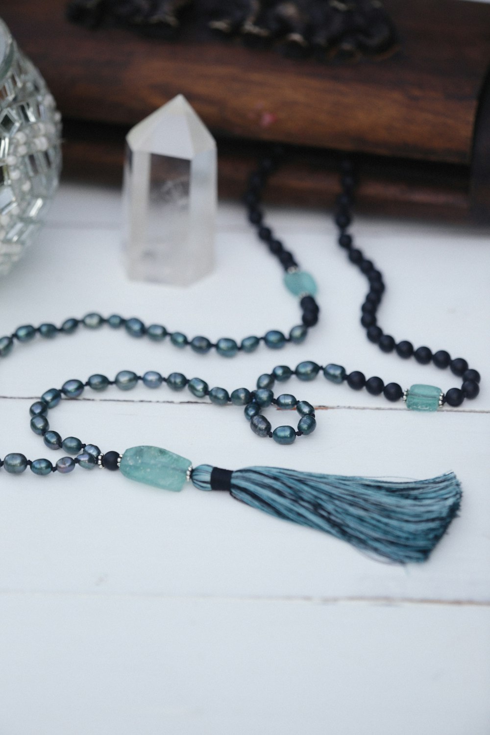 a long beaded necklace with a tassel