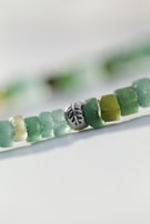 Polymer clay charms shaped like tiny leaves, colored in soothing creme and periwinkle shades.