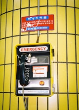 an emergency phone is attached to a wall