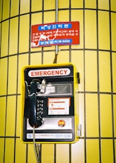 an emergency phone is attached to a wall