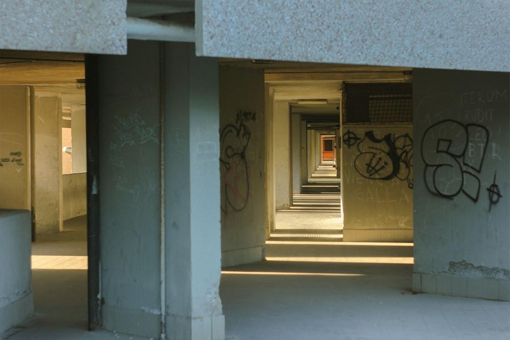 an empty building with graffiti on the walls