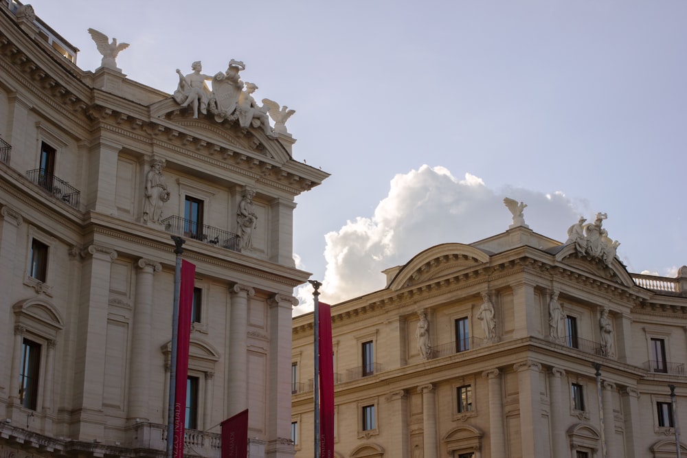 a large building with statues on top of it